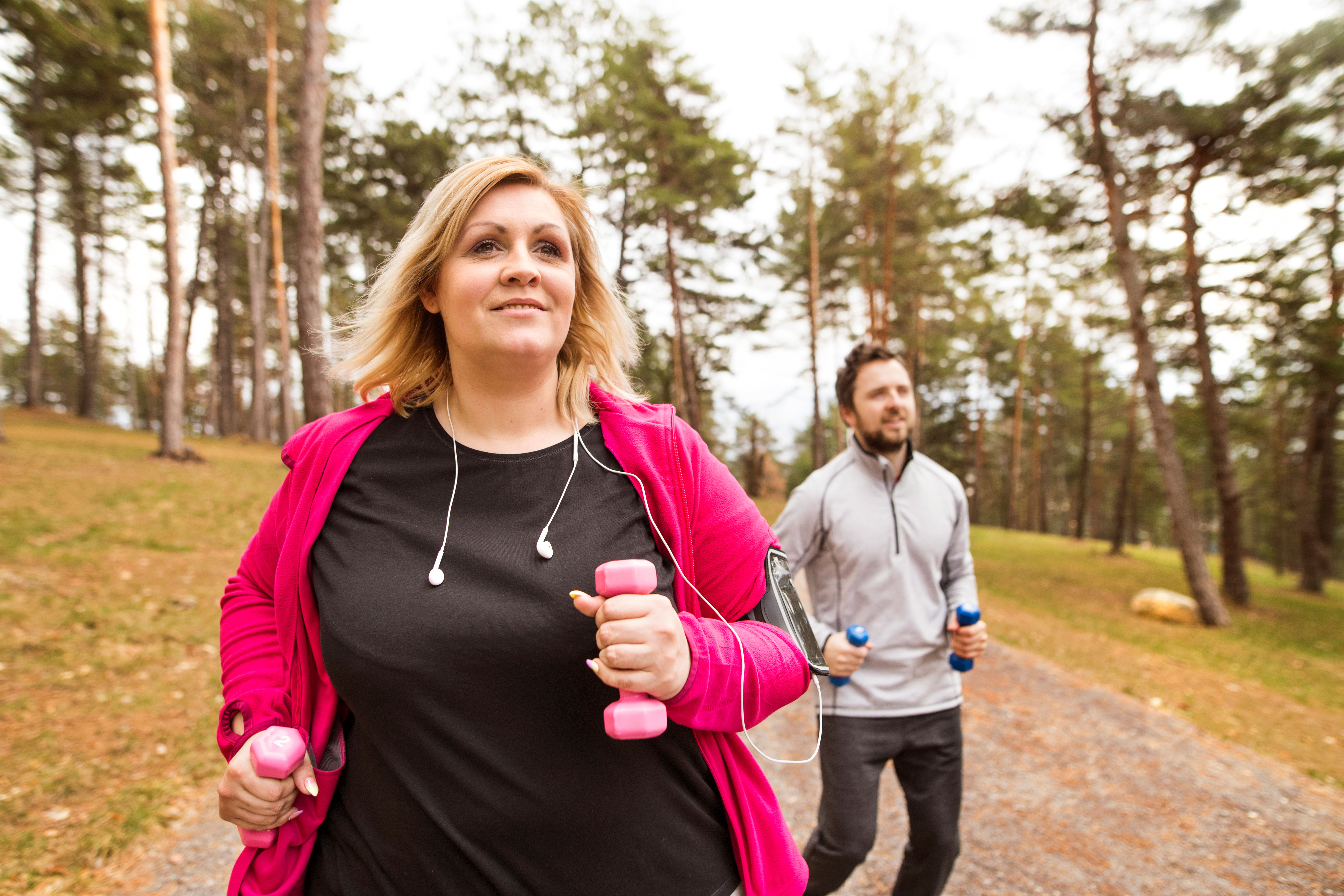 Woman and man exercising outdoors