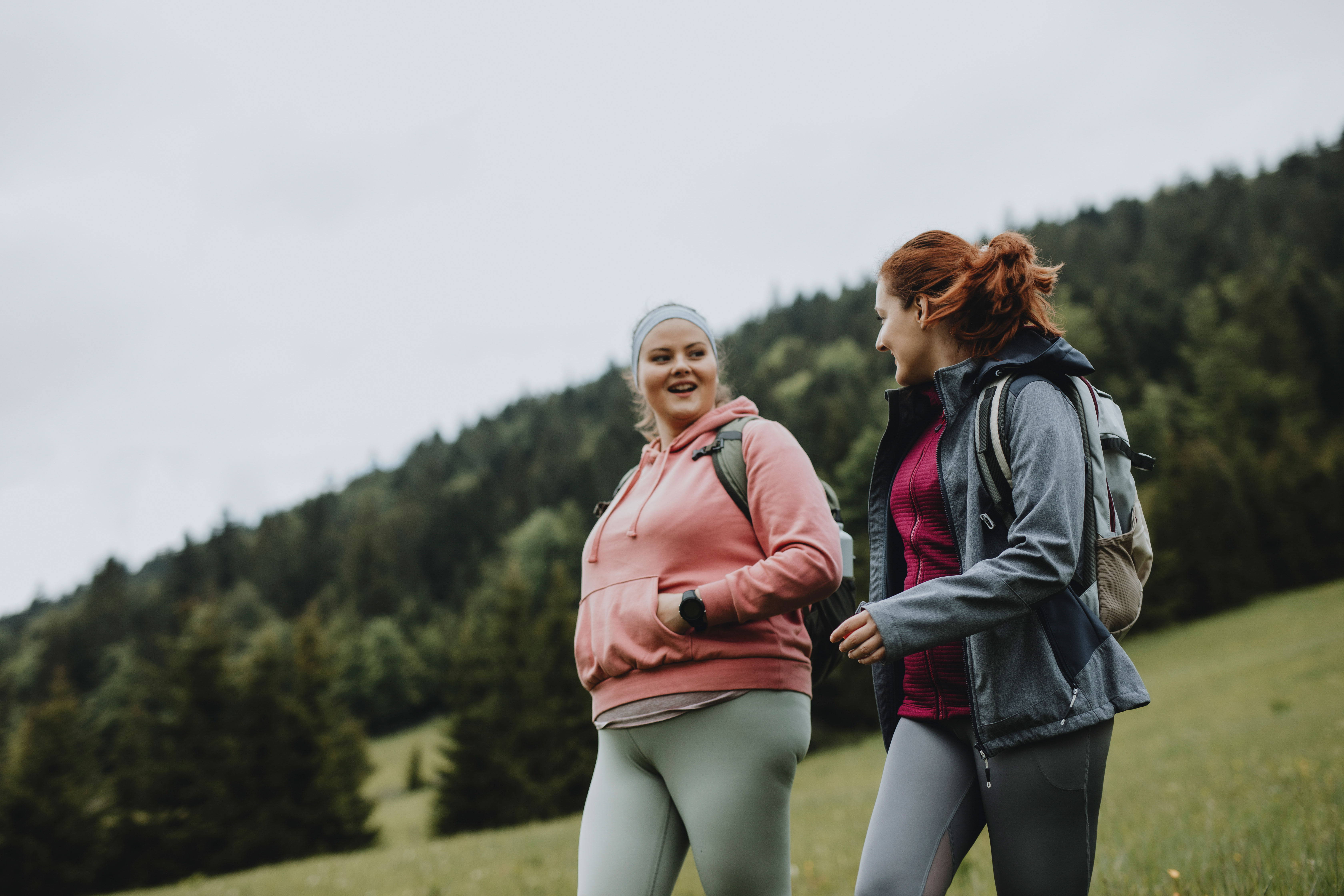 Two women walking outside