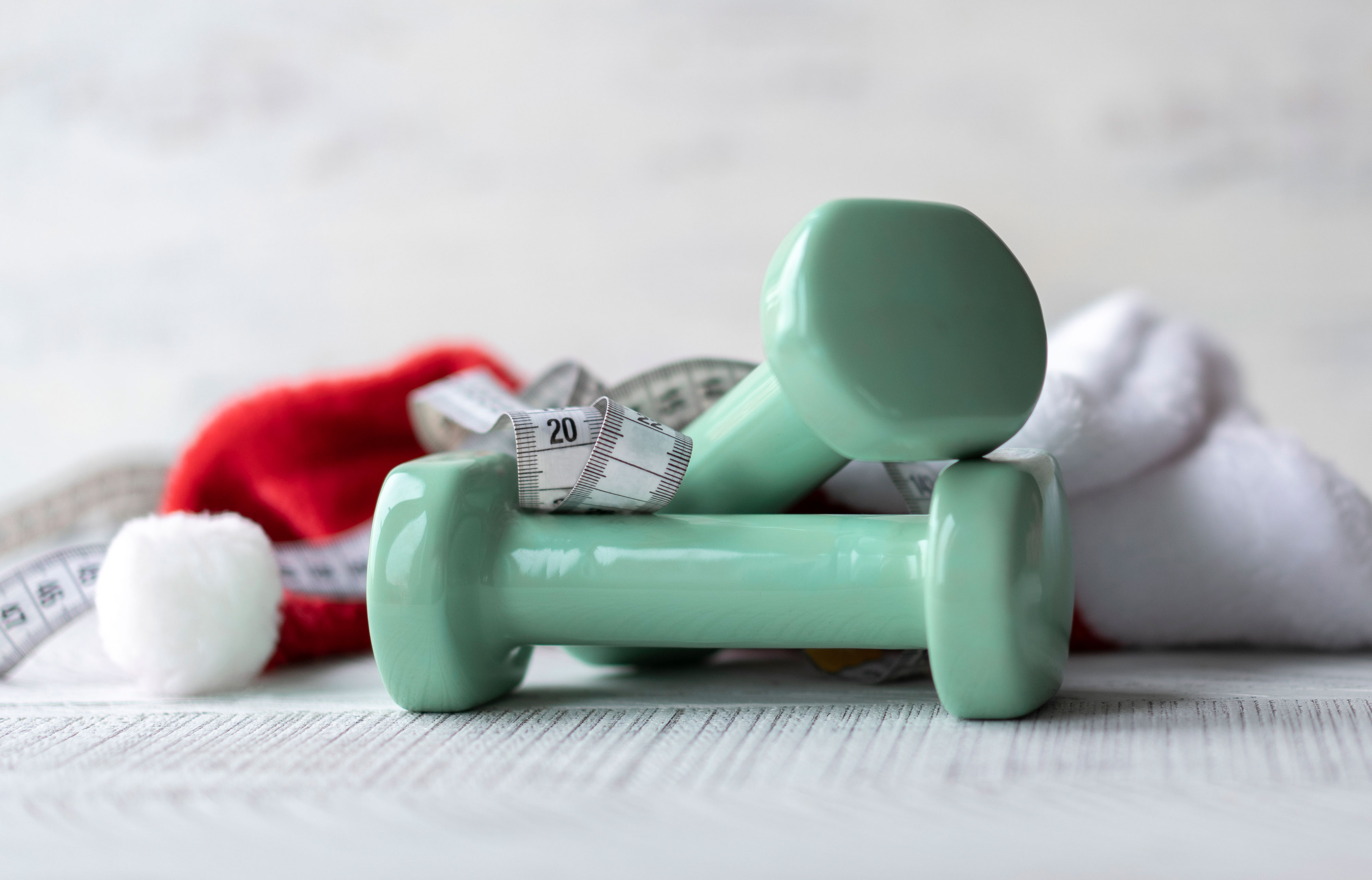 Dumbbells, Santa Claus hat and measuring tape.