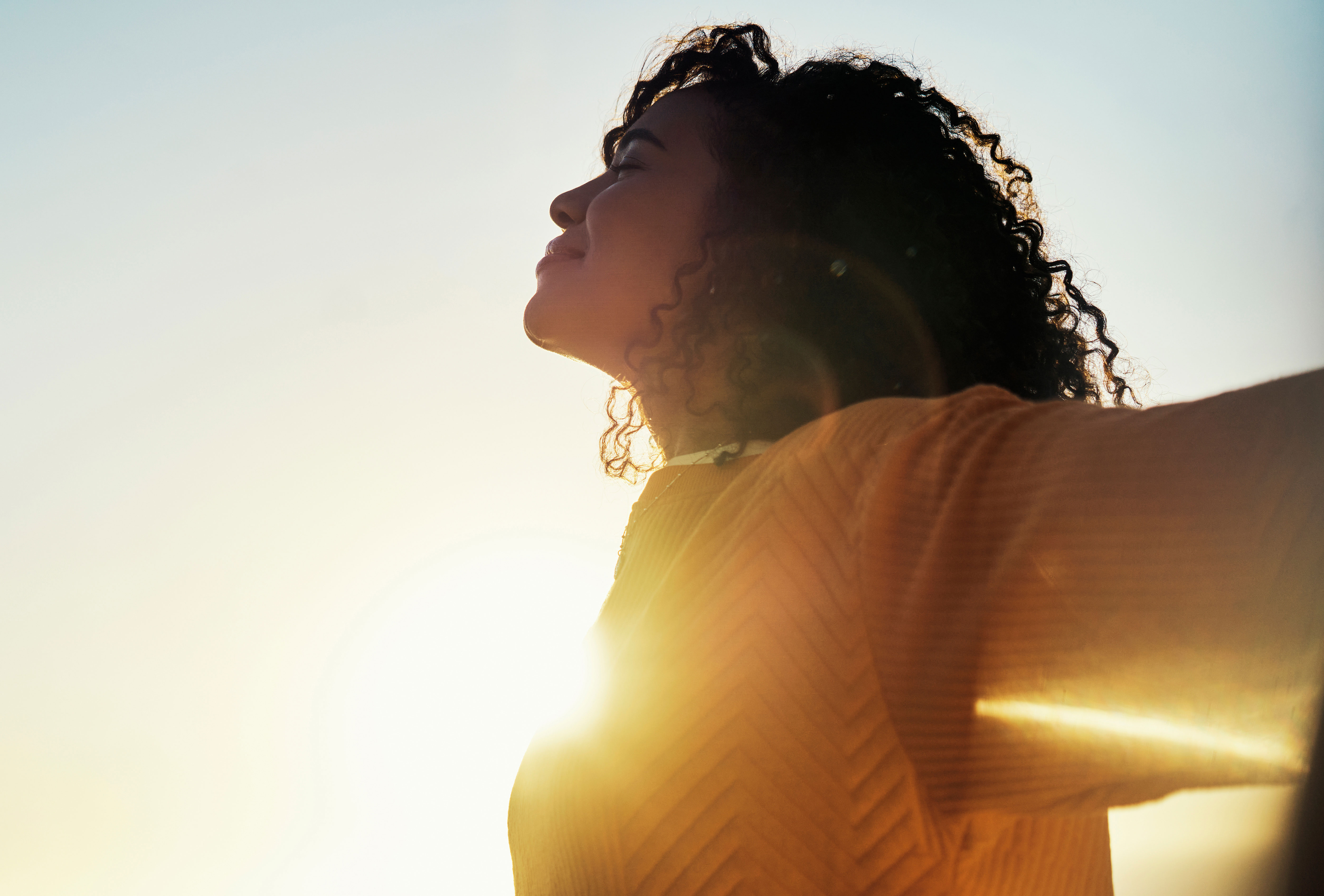 Woman outdoors enjoying a healthy environment Woman outdoors enjoying a healthy environment