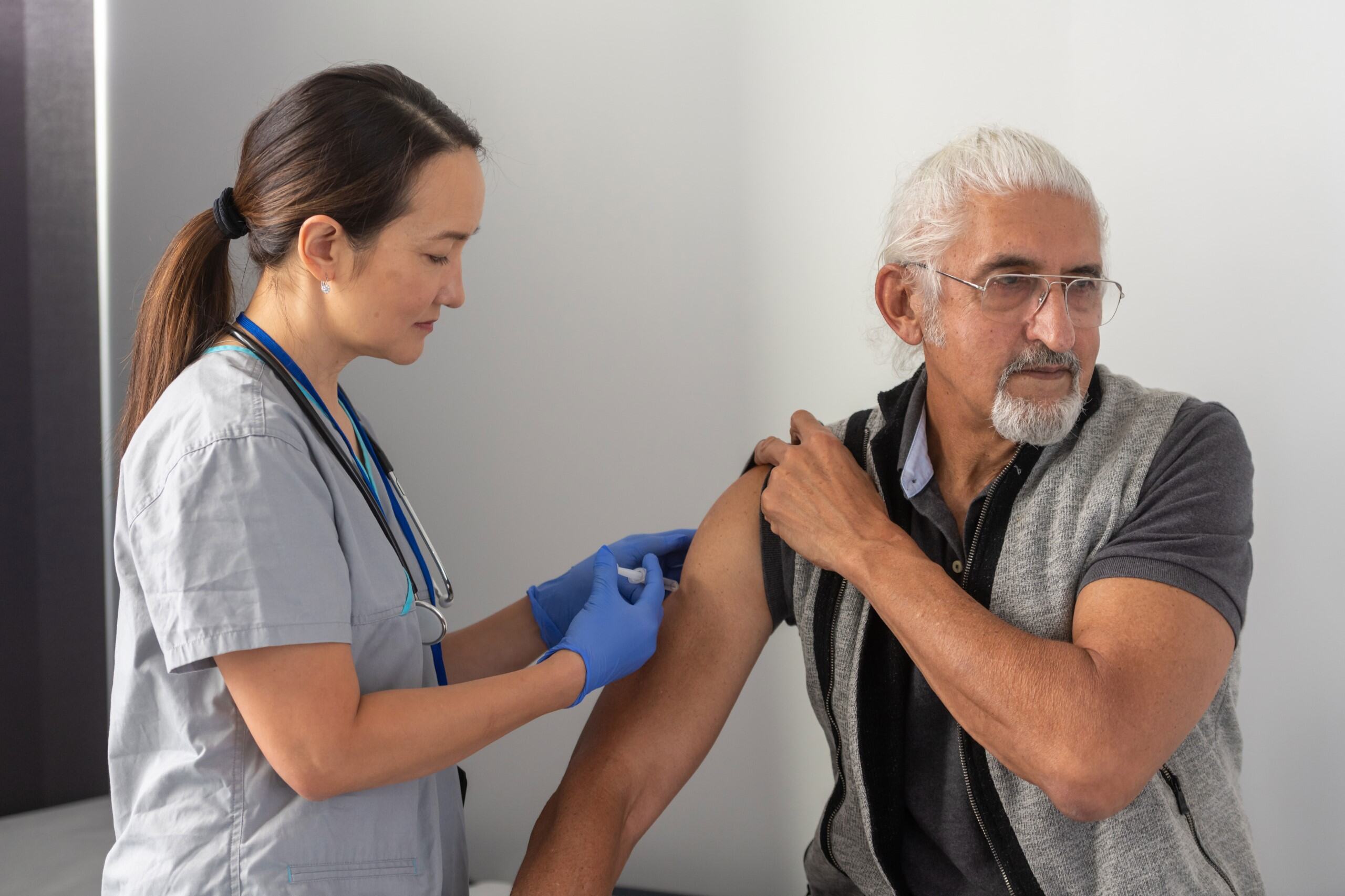 Man getting vaccination Man getting vaccination
