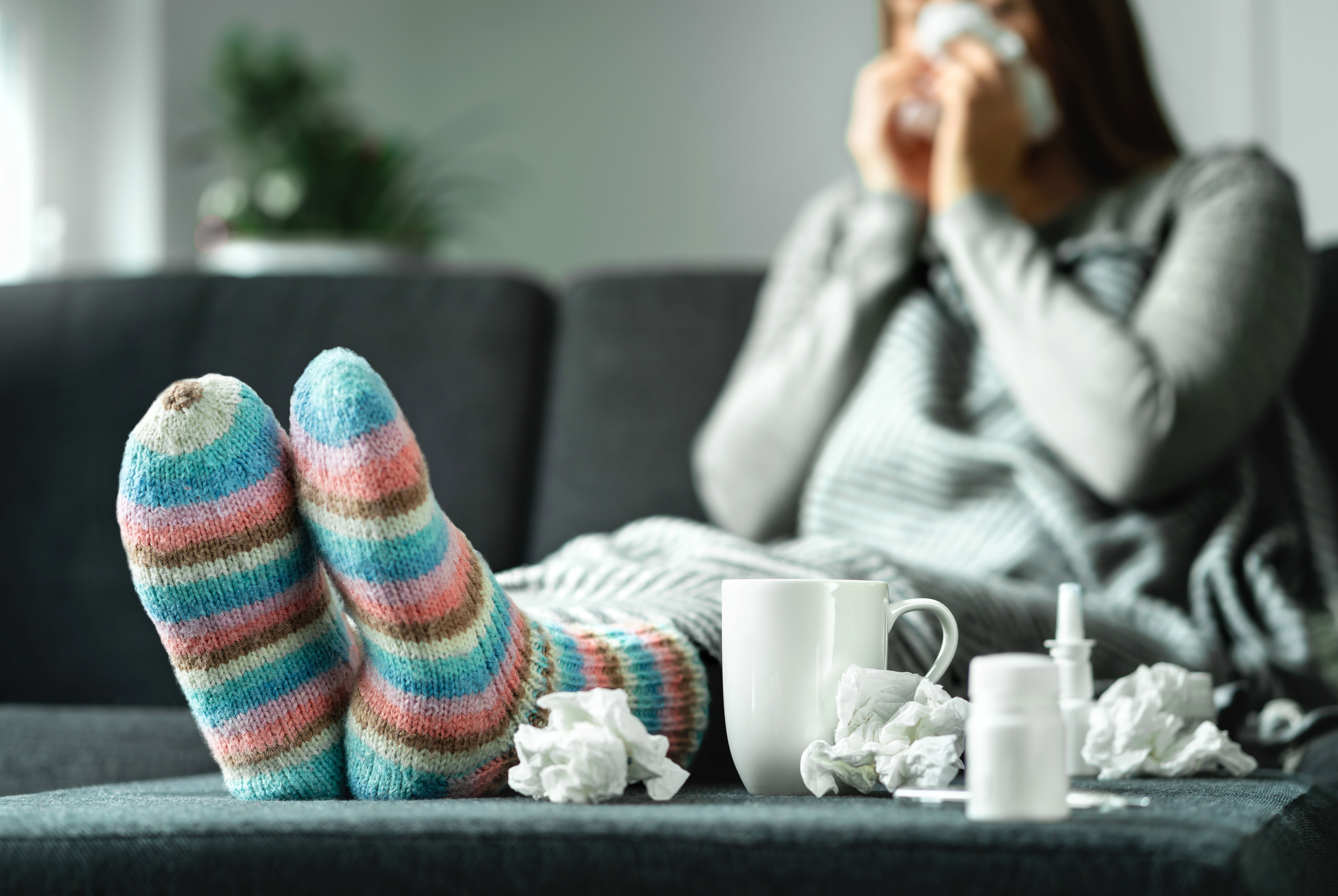 Sick woman with tissues