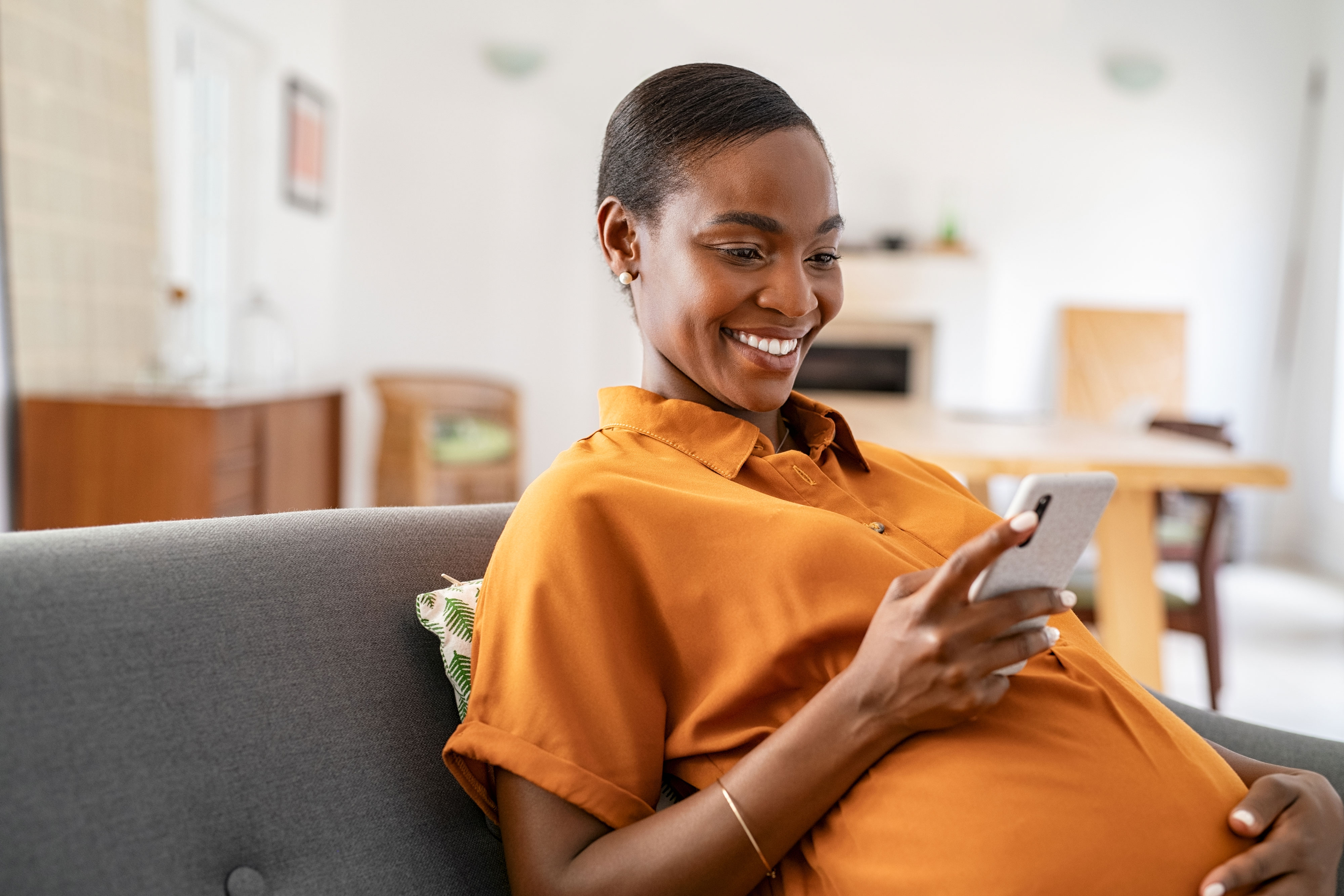 Pregnant woman looking at phone