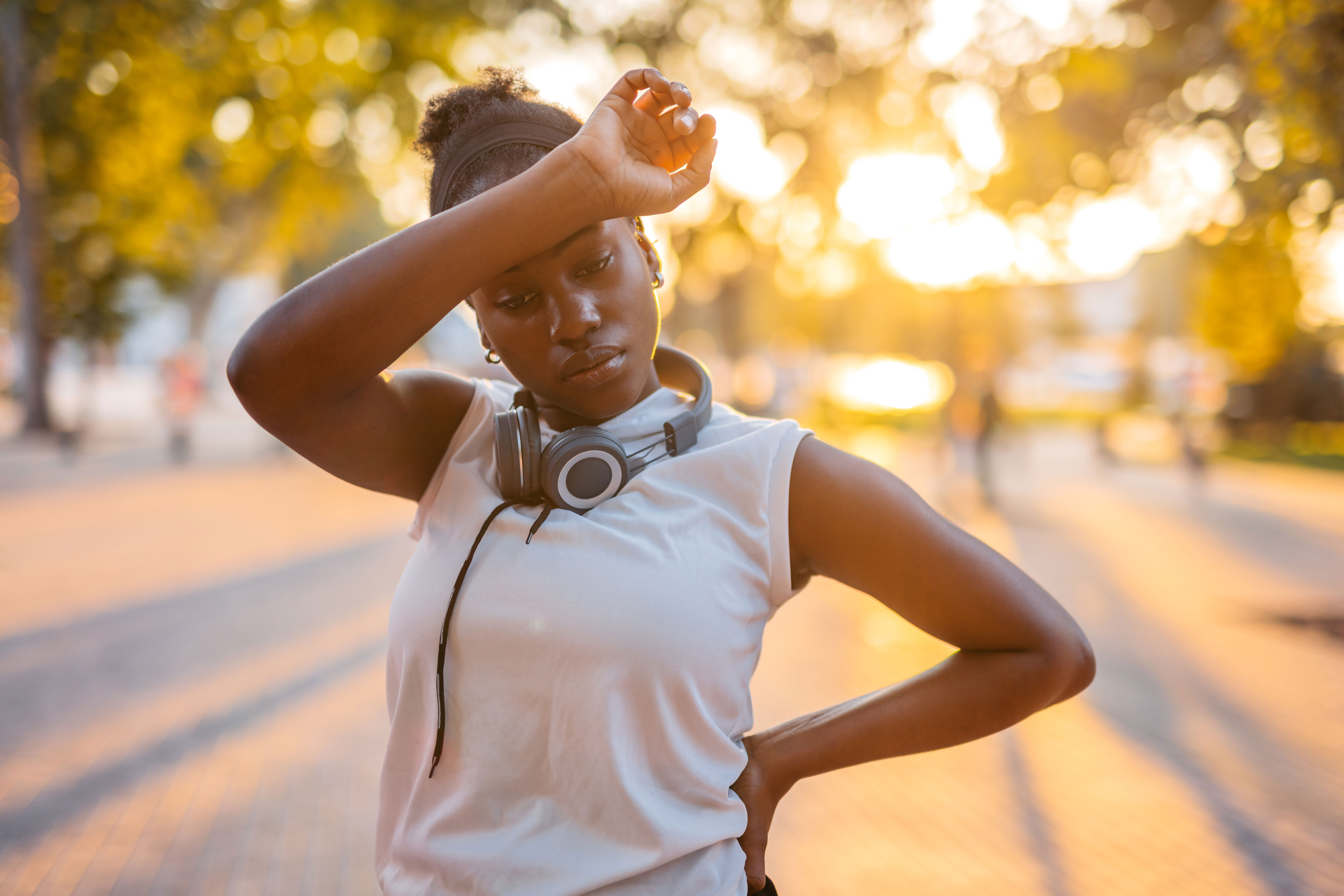 Exhausted female runner outside in the heat