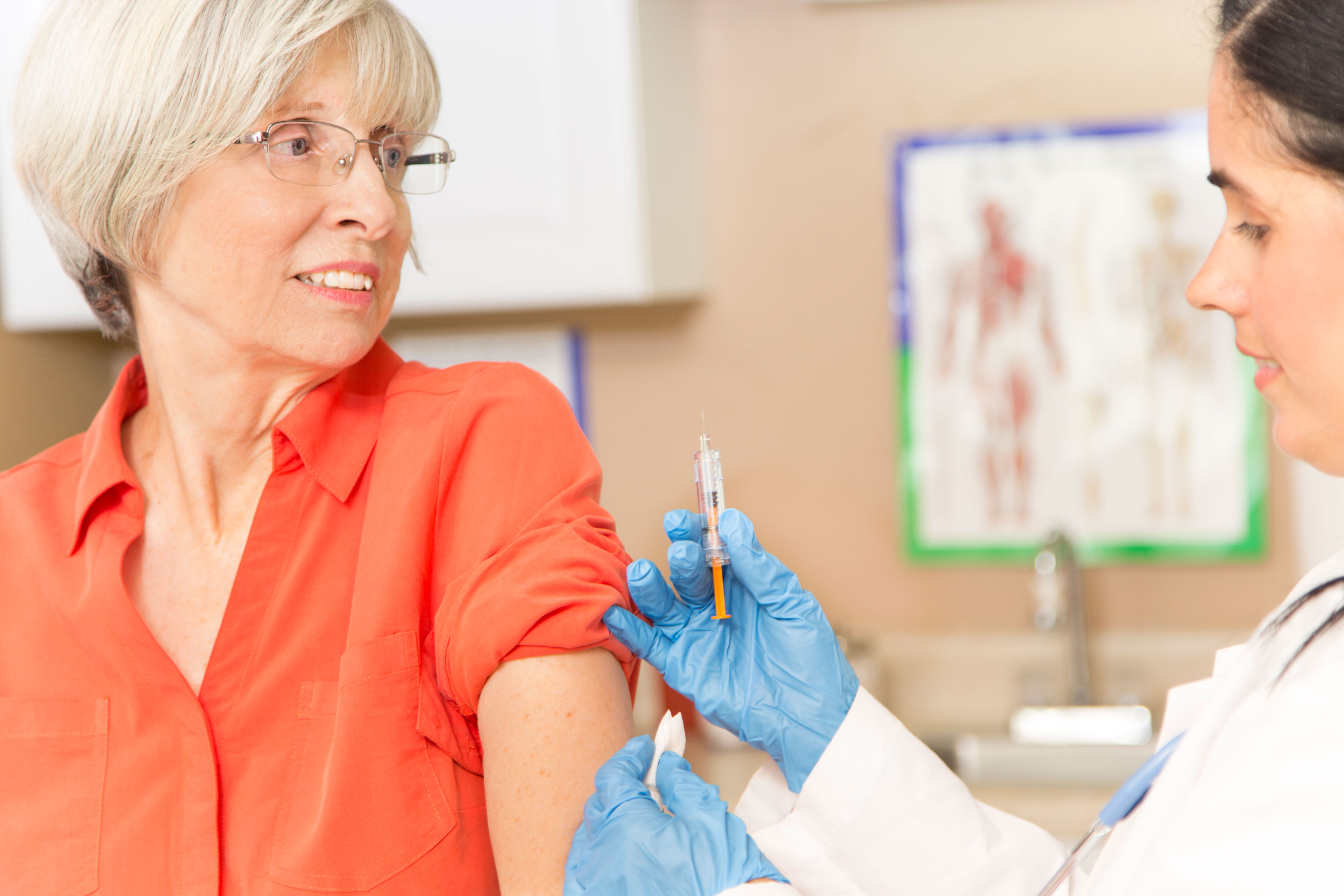 Older woman getting a flu shot