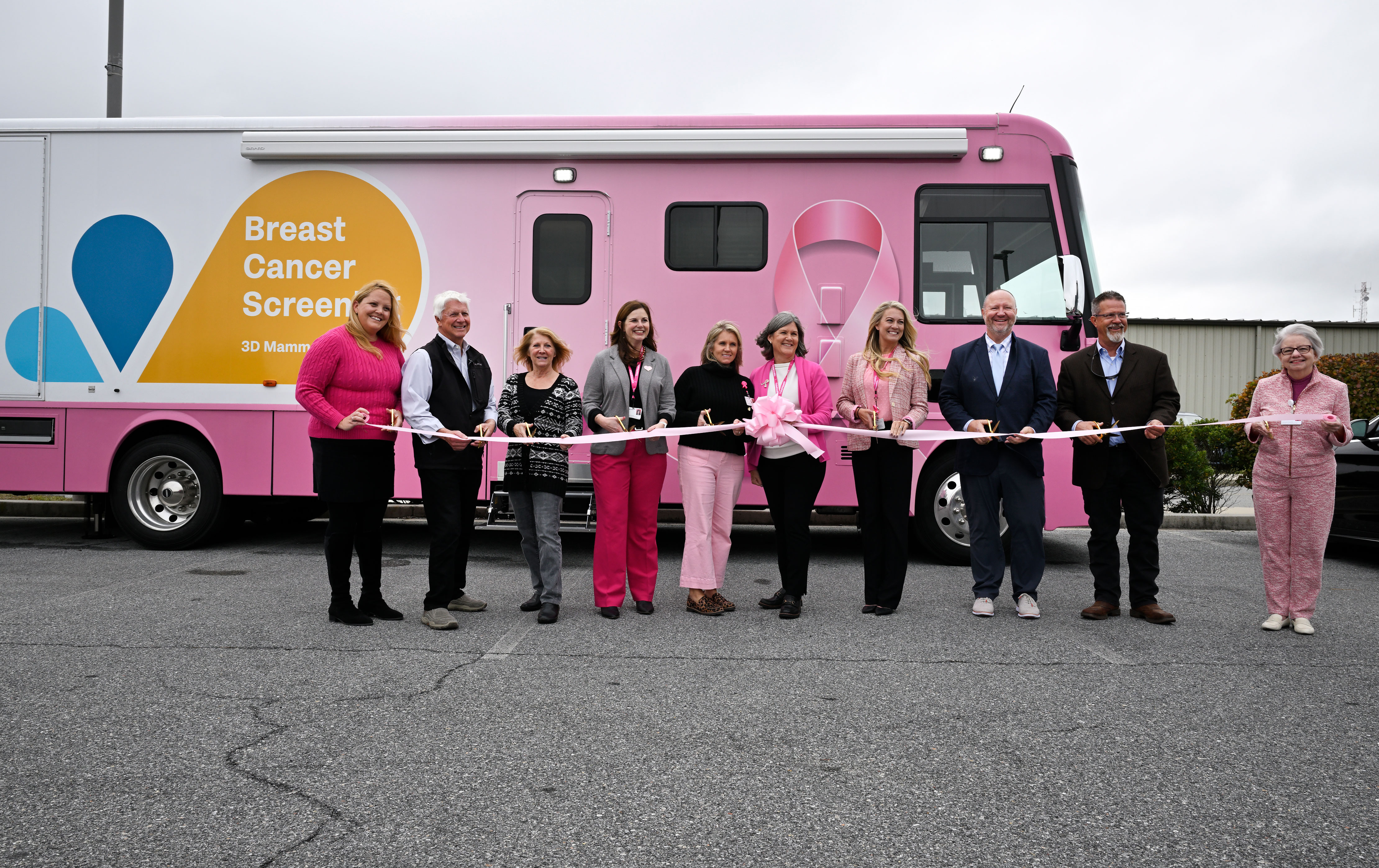 TidalHealth Mobile Mammography ribbon cutting - group of people standing in front of new unit with ribbon