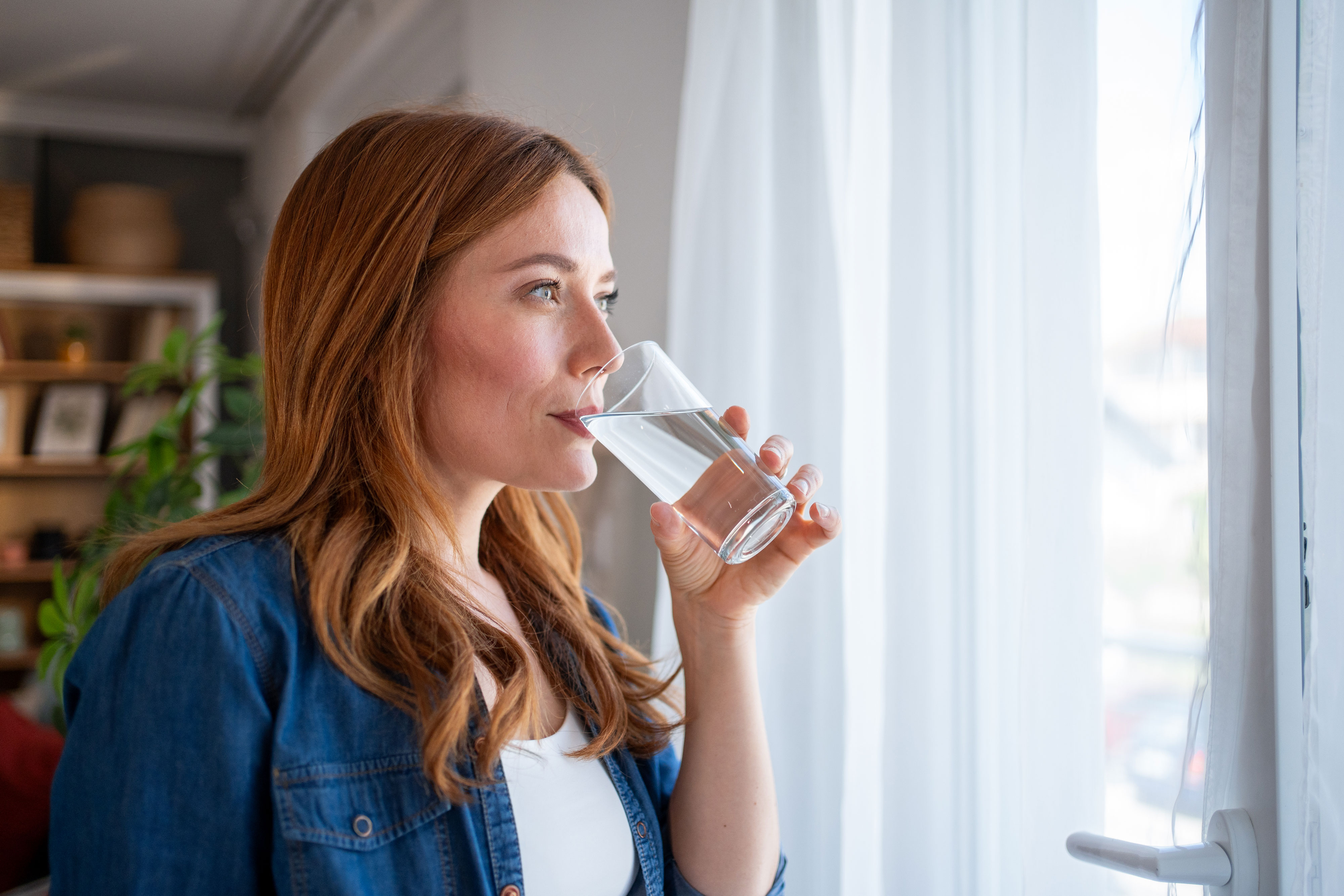 Woman drinking from a glass of water