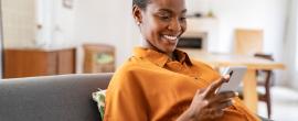 Pregnant woman looking at phone
