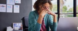 Stressed woman at computer