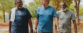 Three men walking outside