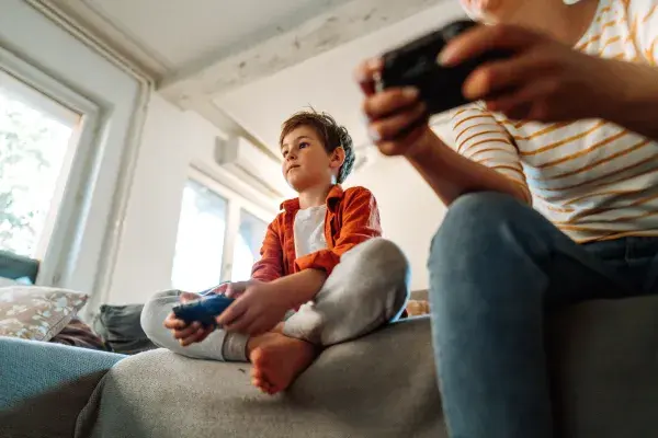 Mother and son playing a video game
