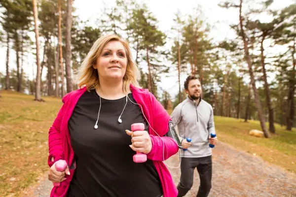 Woman and man exercising outdoors