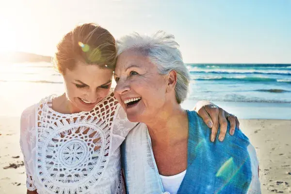 Women smiling on the beach