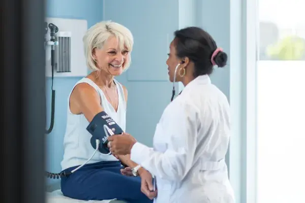 Woman getting blood pressure checked