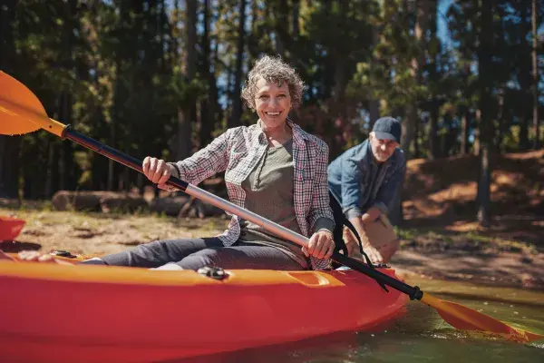 Woman kayaking on a lake
