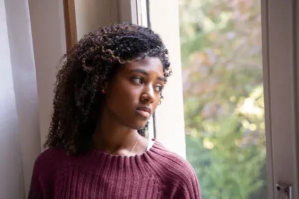 Woman looking out the window