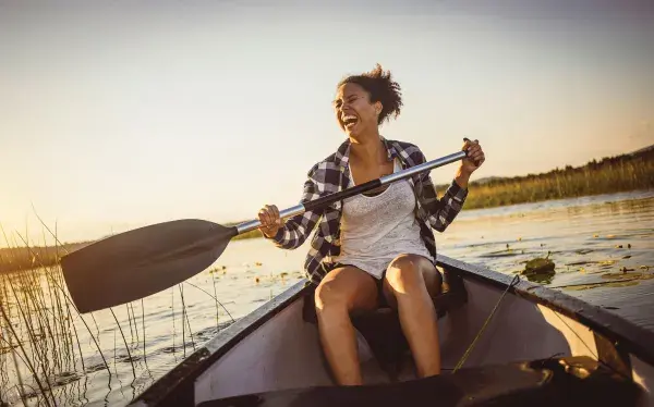 A woman enjoying the outdoors on Delmarva by canoe