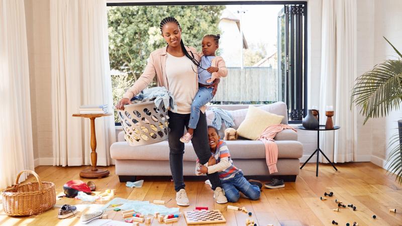 A busy mom at home with her child.