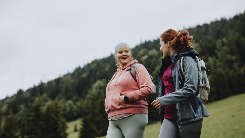Two women walking outside