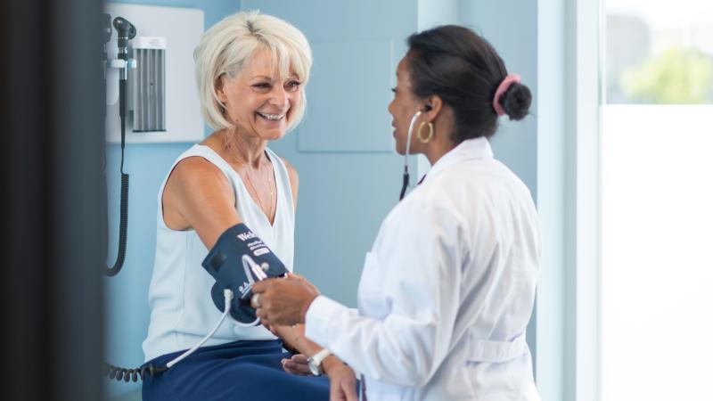 Woman getting blood pressure checked