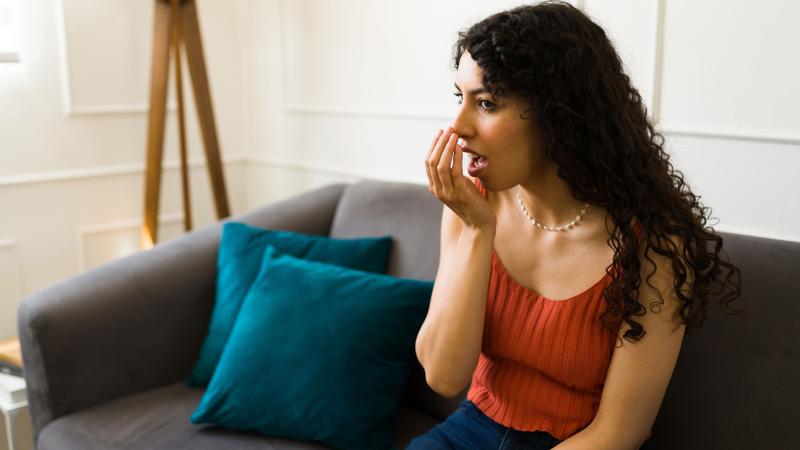 Woman checking her breath