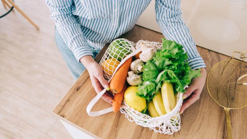 Eco-friendly grocery bags with veggies