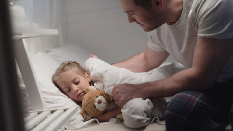 Father and daughter at bedtime