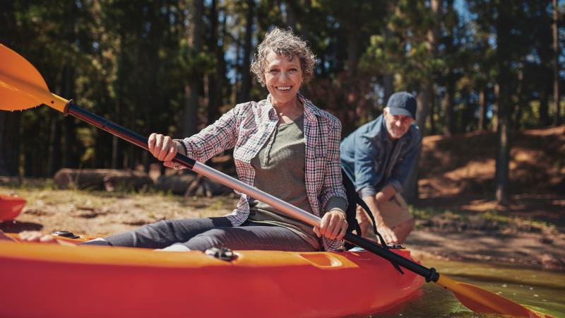 Woman kayaking on a lake
