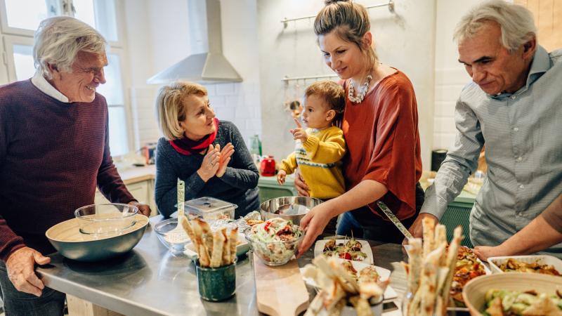 Family preparing holiday meal in the kitchen