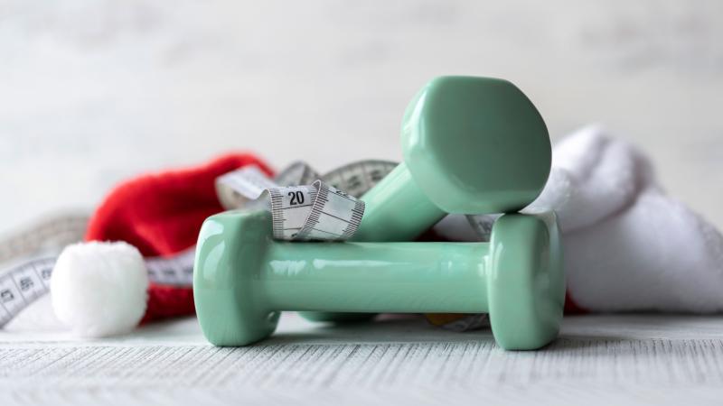 Dumbbells, Santa Claus hat and measuring tape.