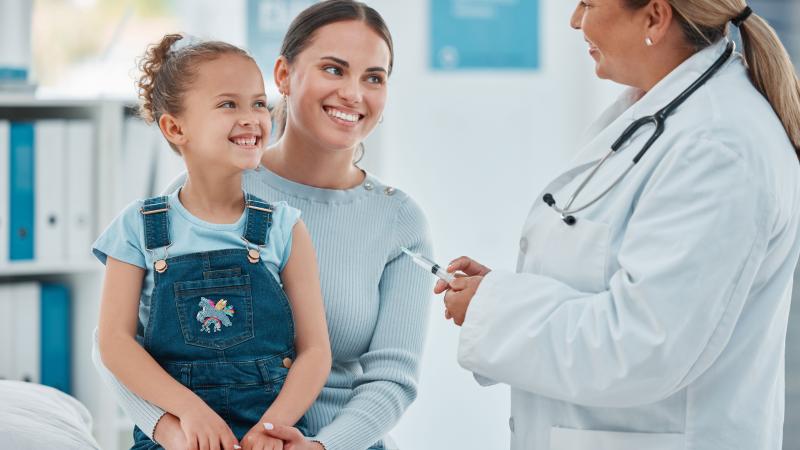 Healthcare professional preparing to administer a flu shot to a patient. A person receives a flu vaccine for winter wellness and immune system support.