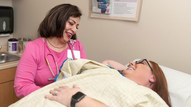 Dr. Abha Gupta speaks to a patient a screening appointment