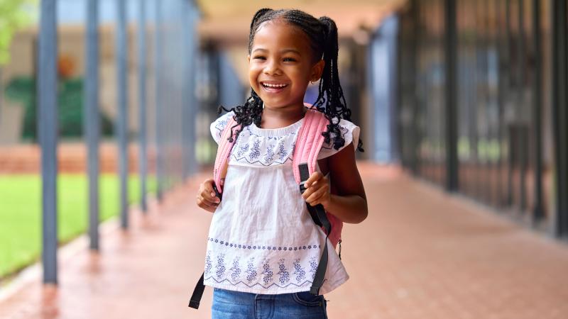 Elementary school child excited for back-to-school