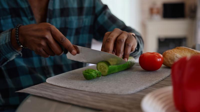 Man preparing a healthy salad