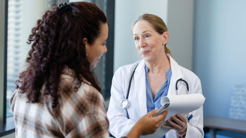 Doctor sharing news with patient