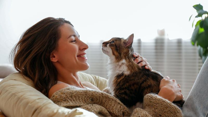 Woman relaxing with cat