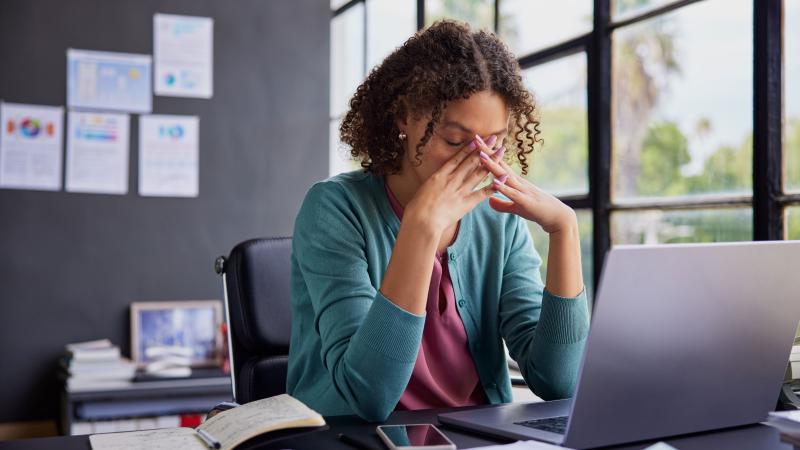 Stressed woman at computer