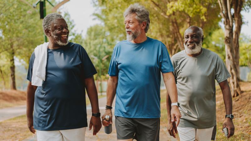 Three men walking outside