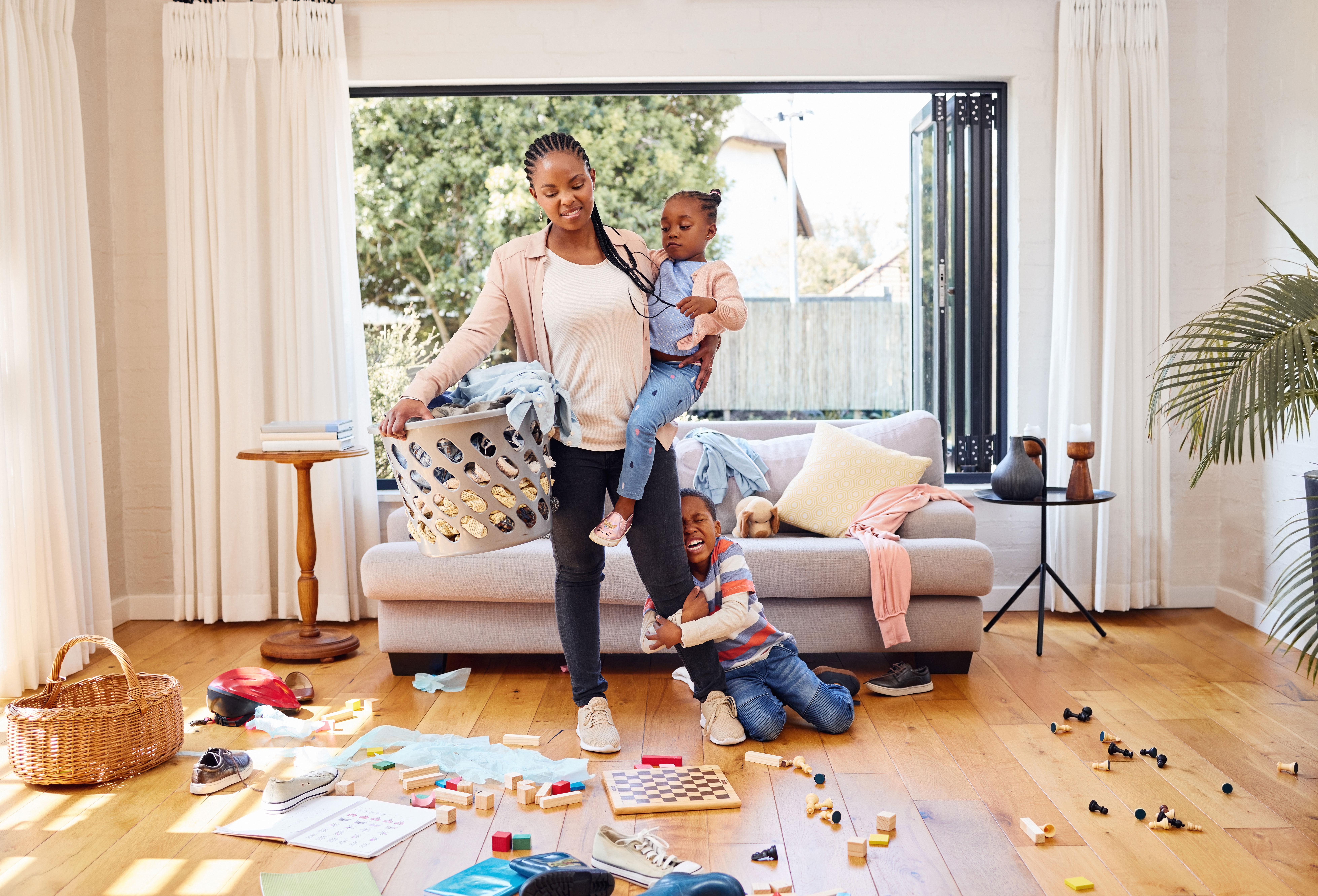 A busy mom at home with her child.