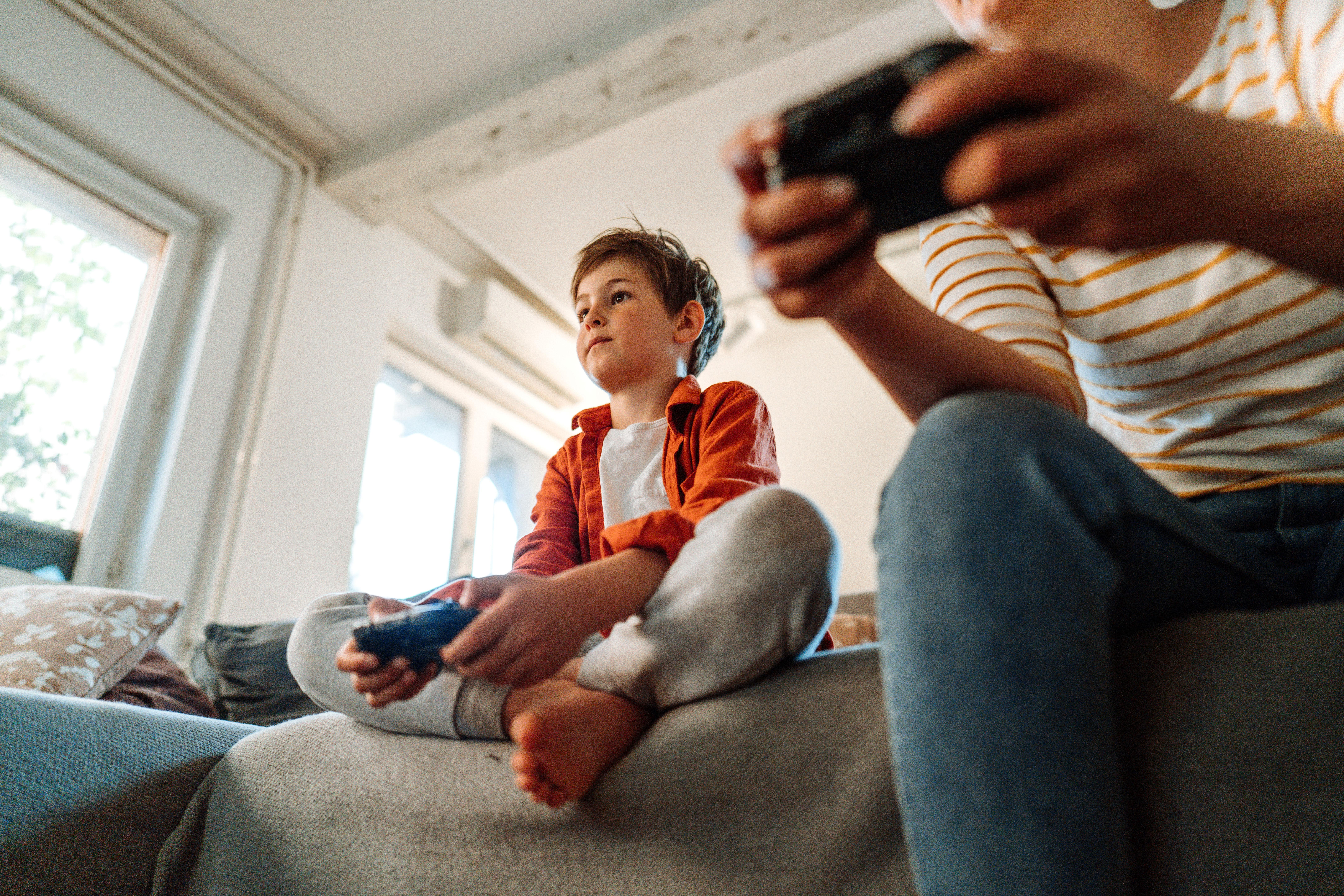 Mother and son playing a video game
