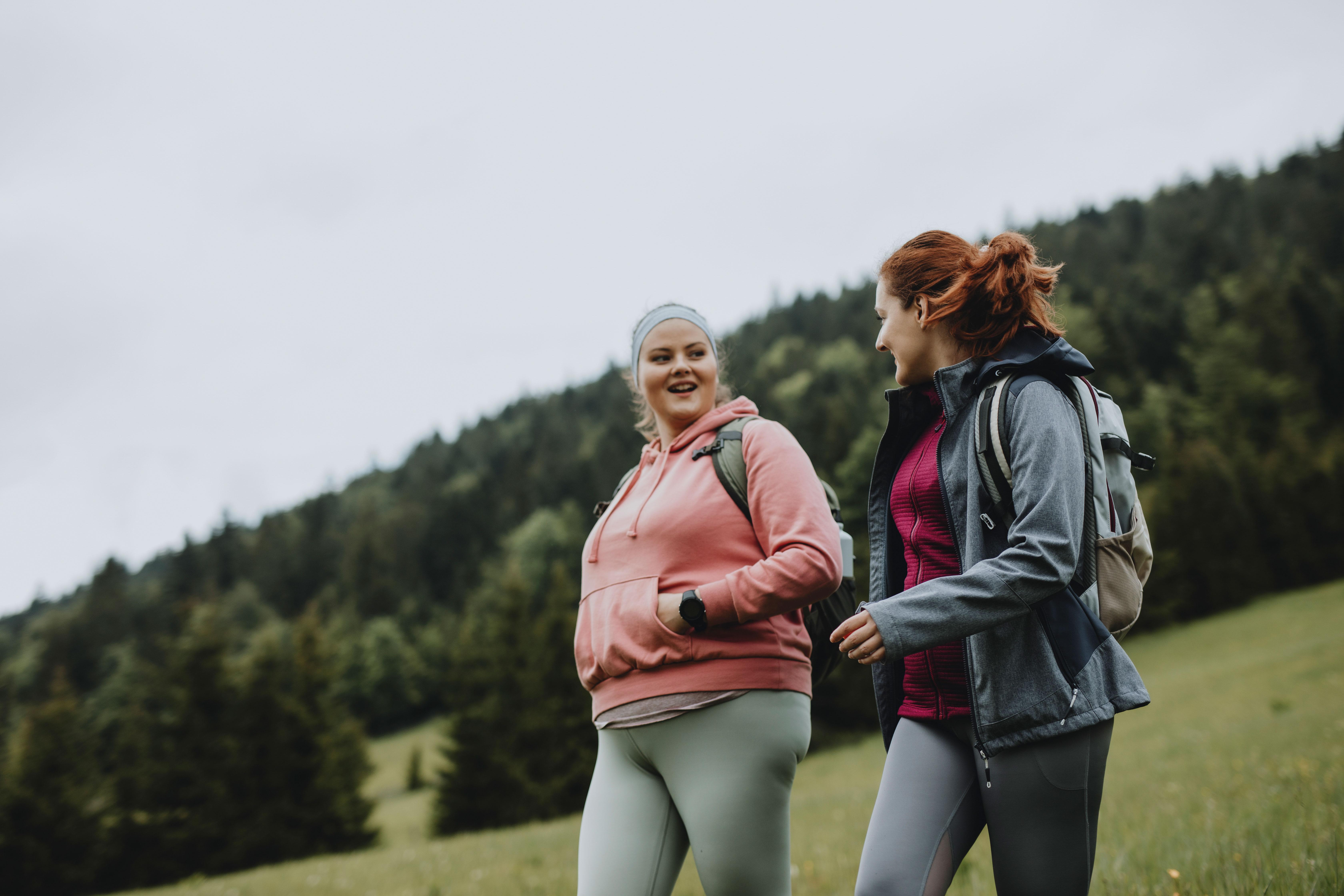 Two women walking outside