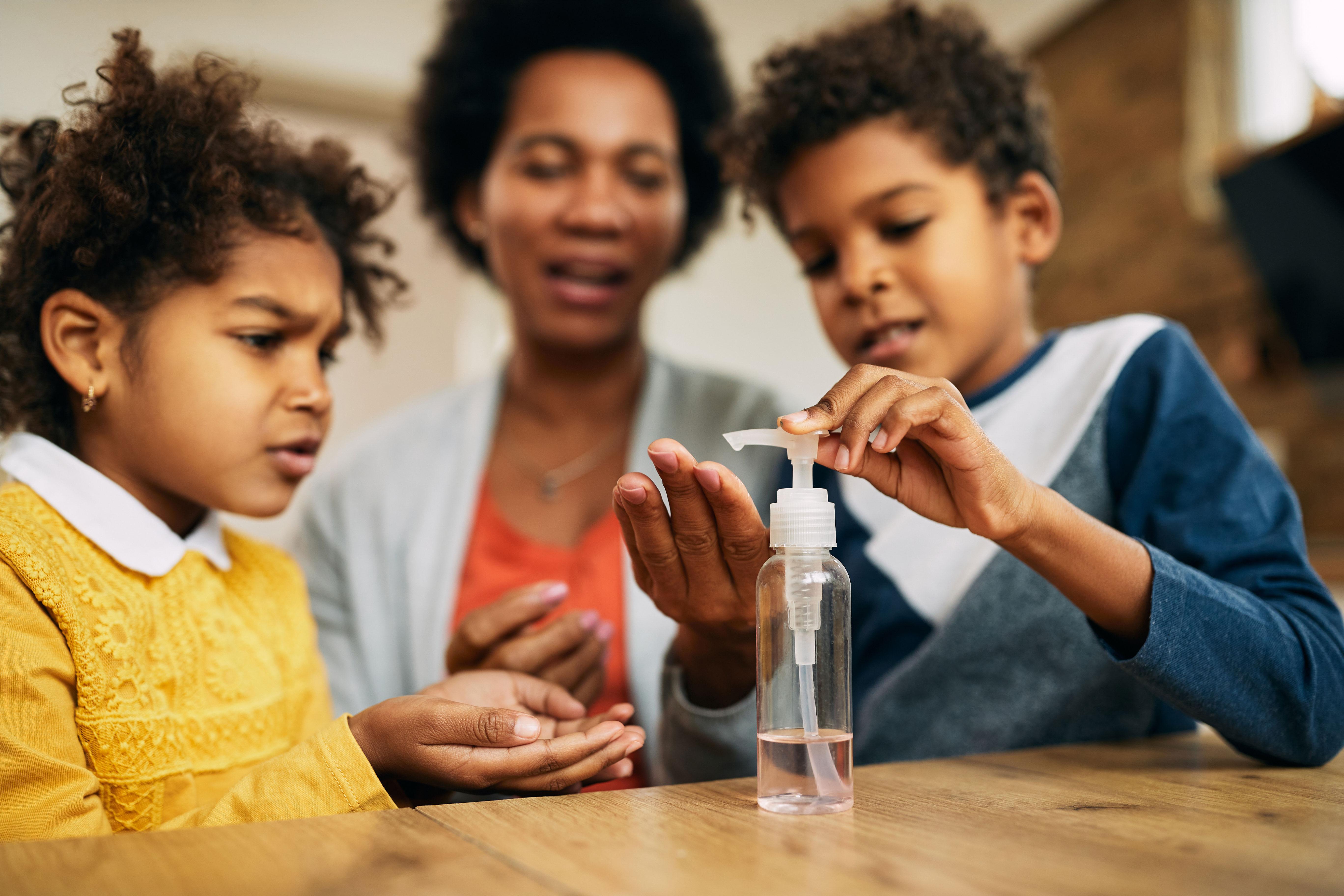 Children performing hand hygiene to prevent back-to-school illness