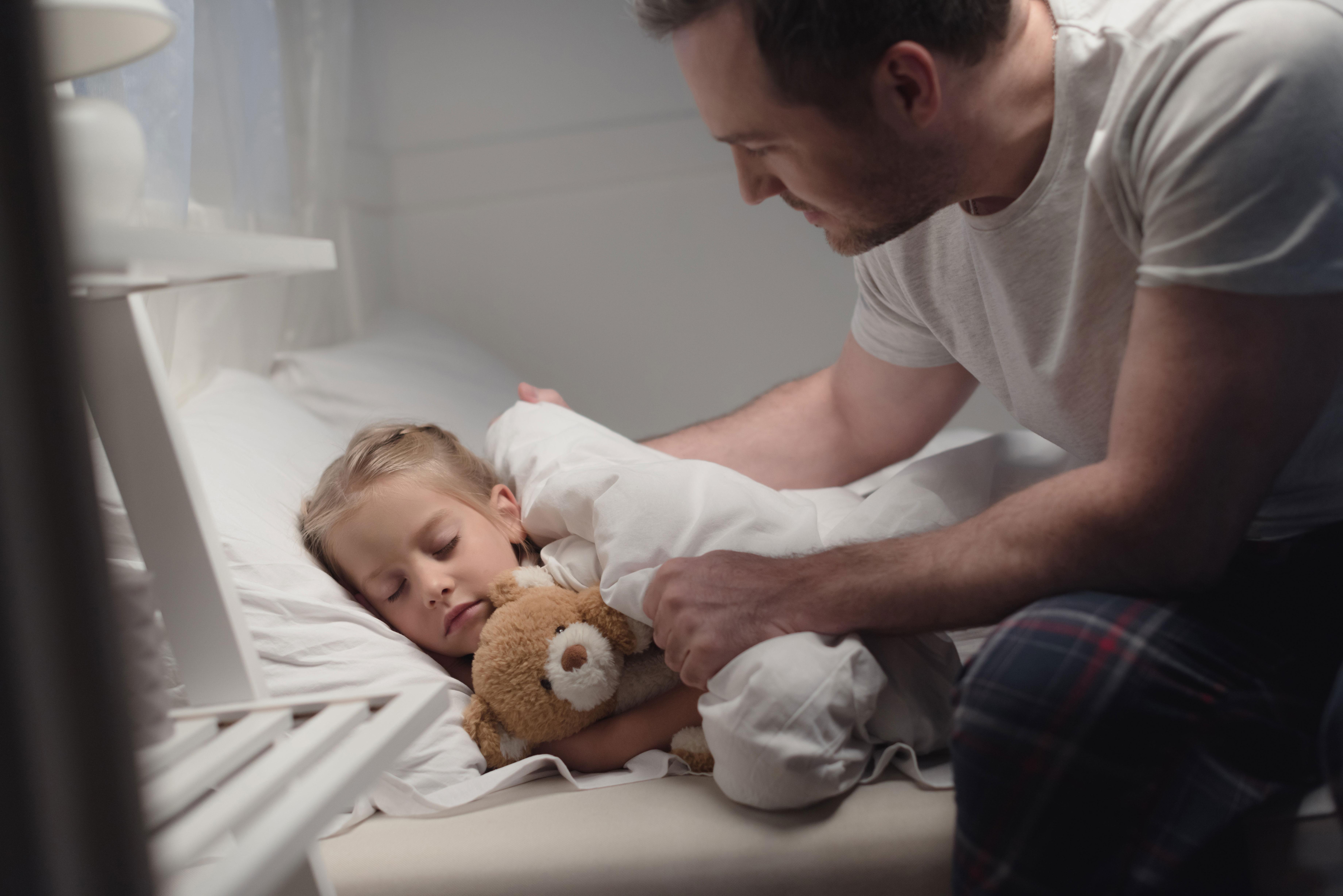 Father and daughter at bedtime