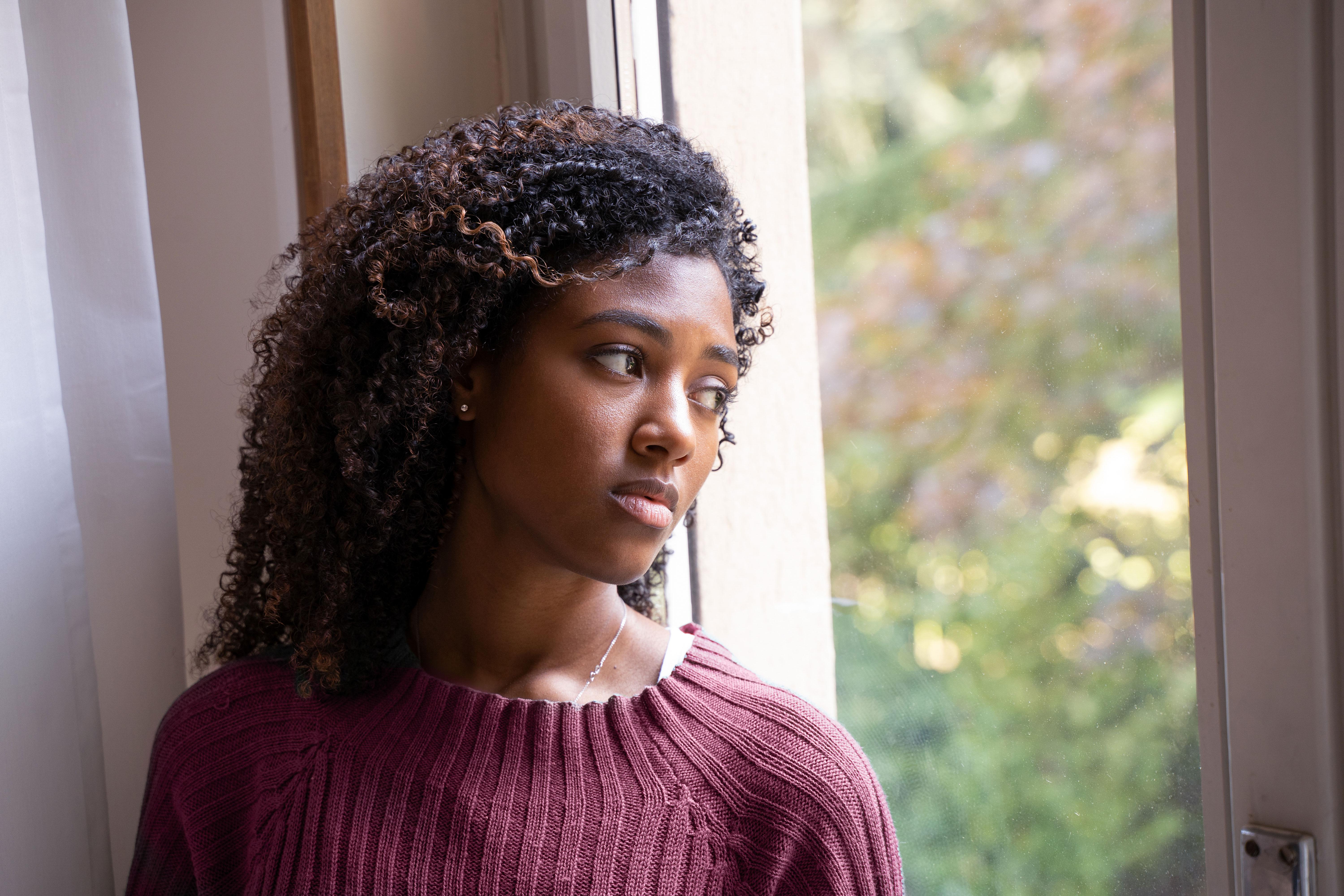 Woman looking out the window