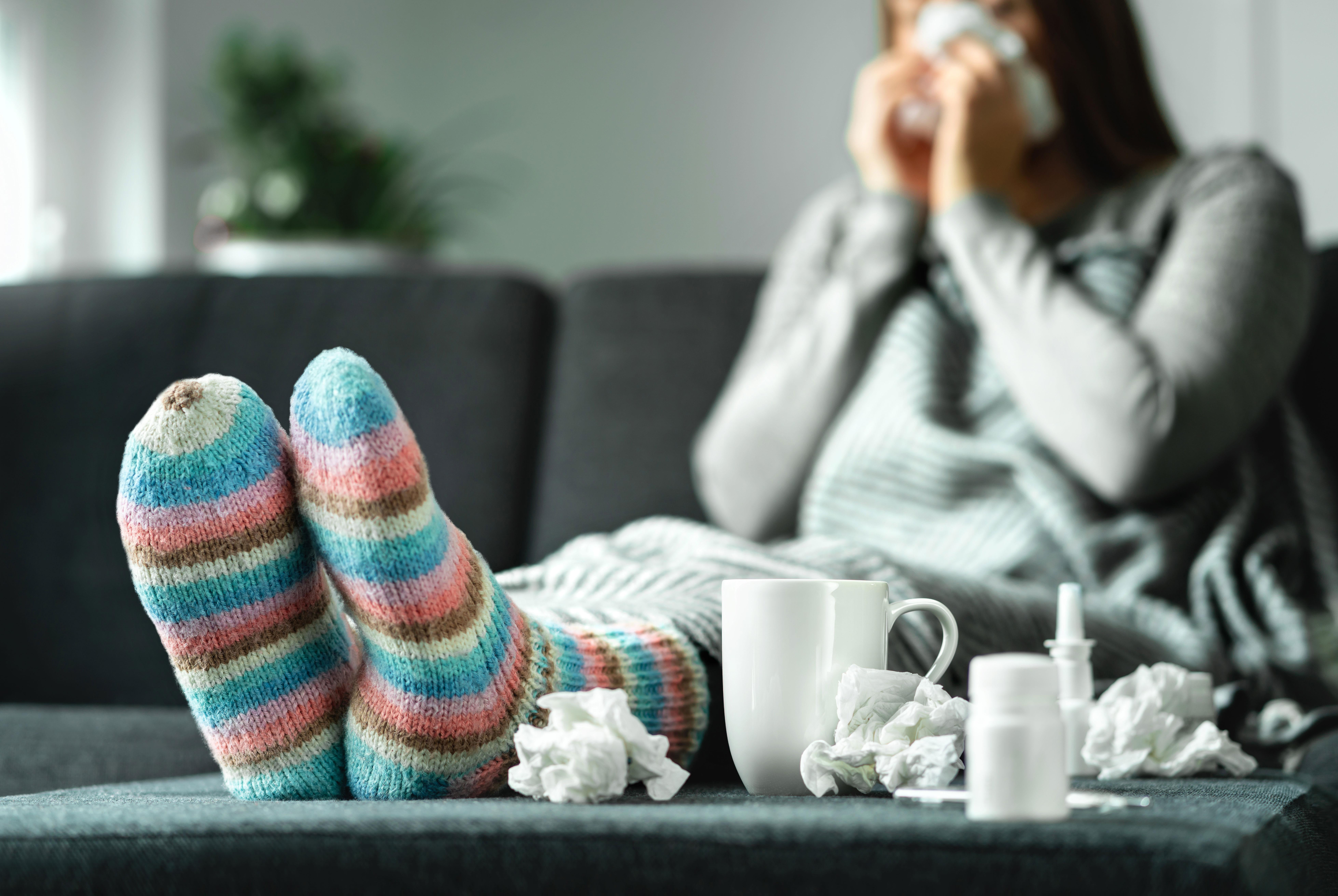 Sick woman with tissues