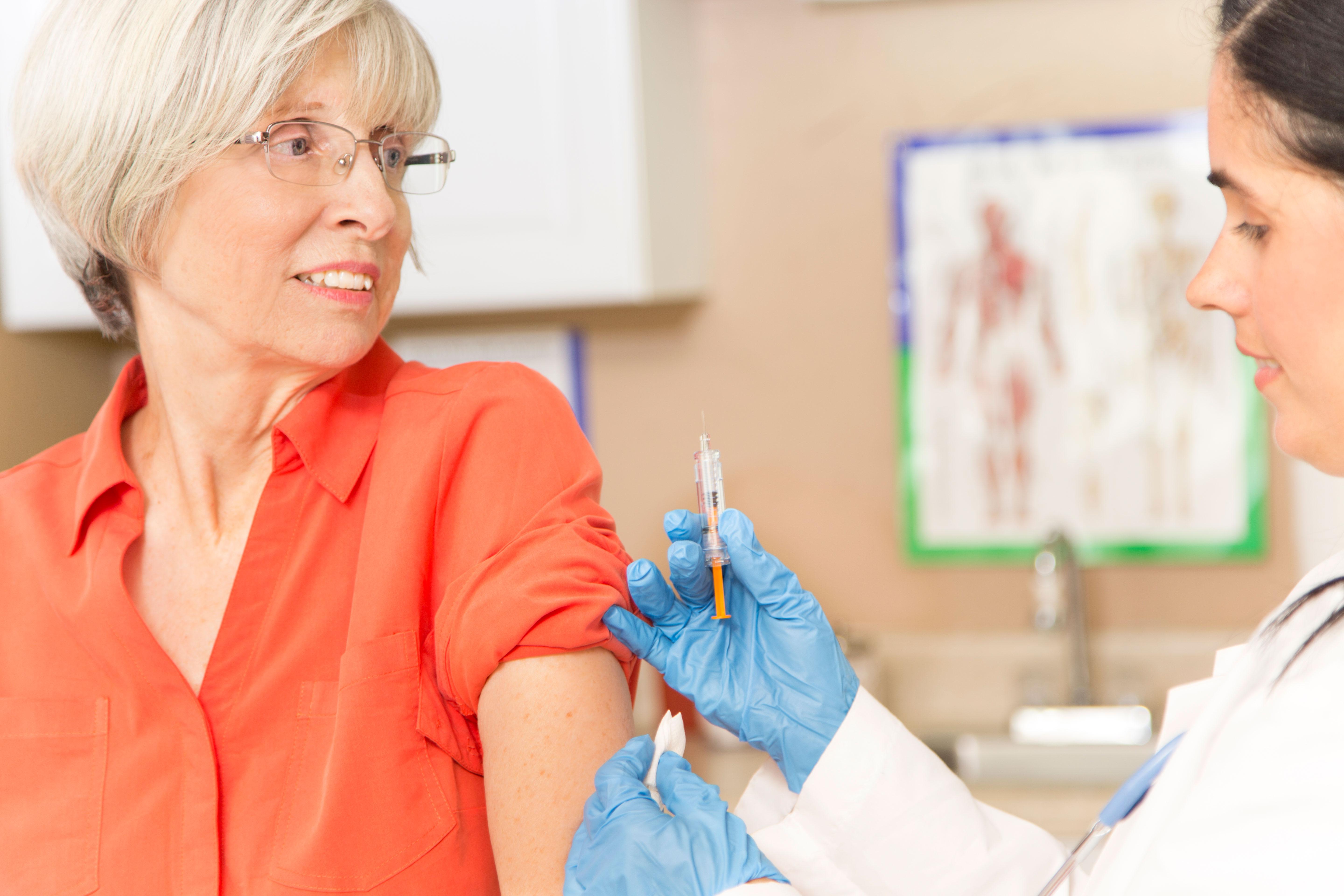 Older woman getting a flu shot