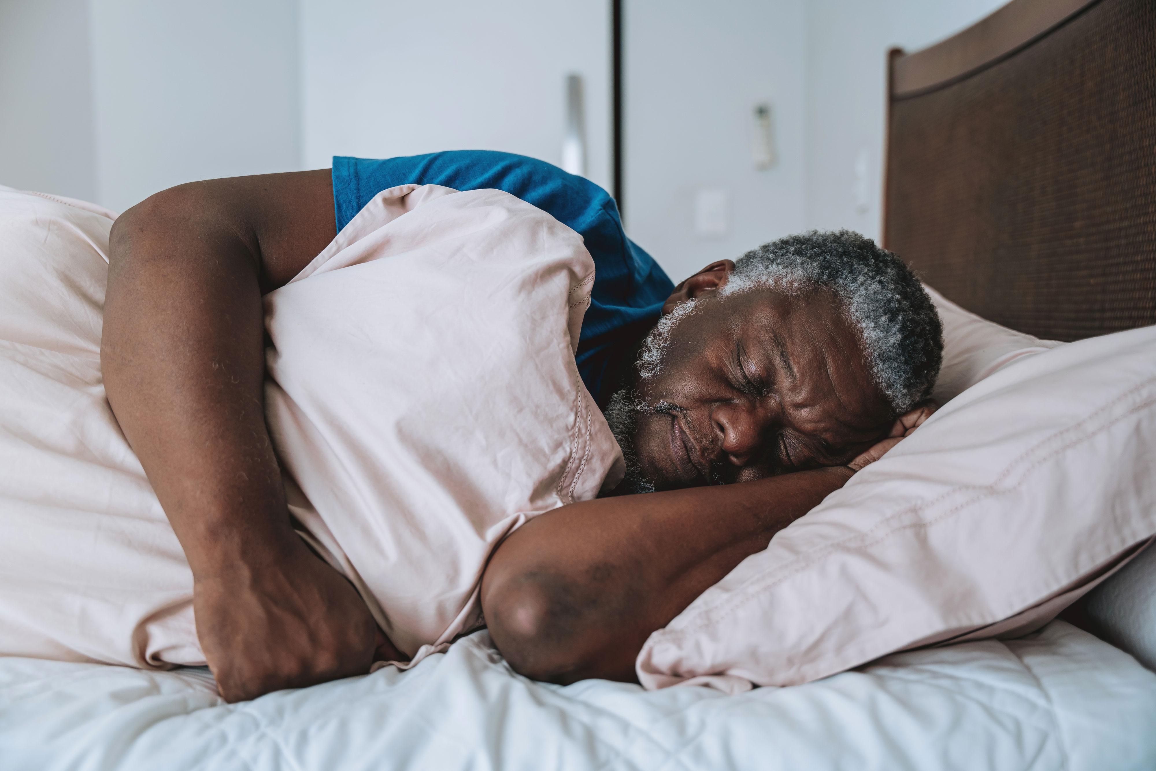 Sleeping man in bed