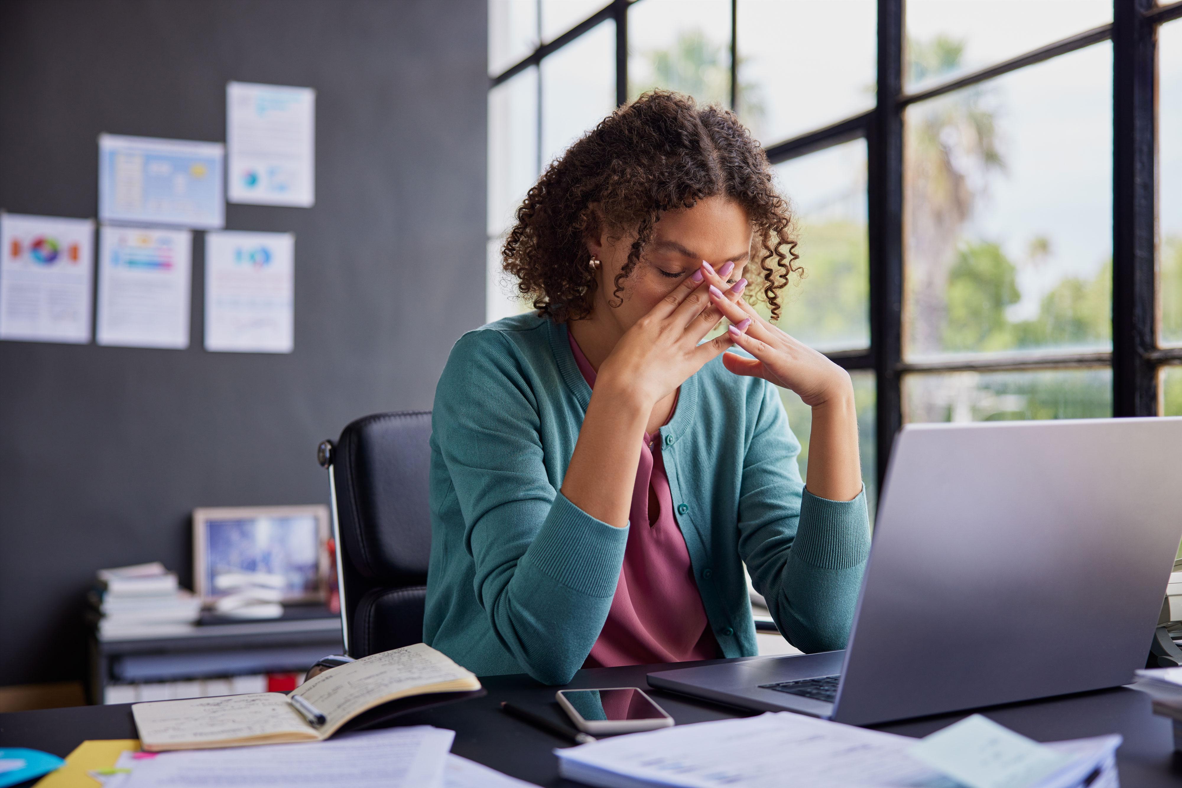Stressed woman at computer