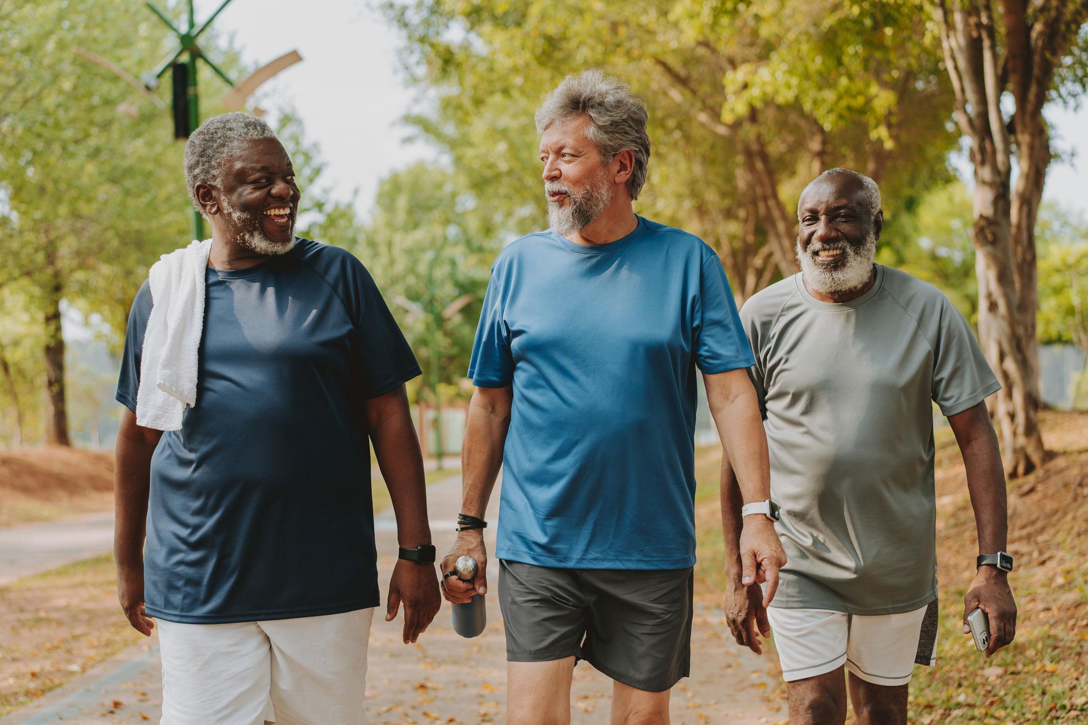 Three men walking outside