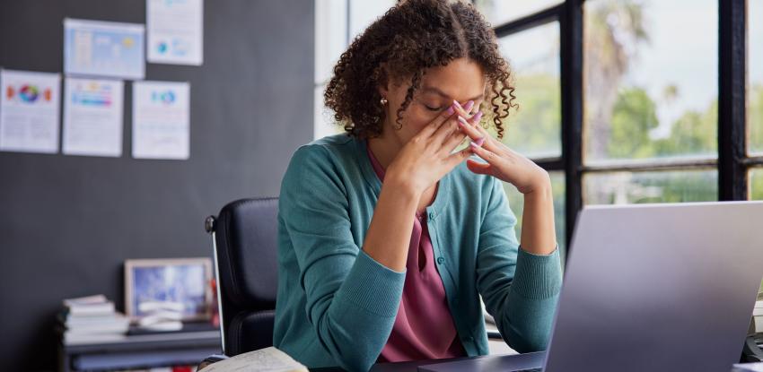 Stressed woman at computer